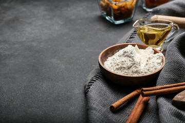 Fototapeta premium Ingredients for preparing bakery and utensils on dark background