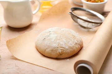 Fresh dough with ingredients for preparing bakery and utensils on color background