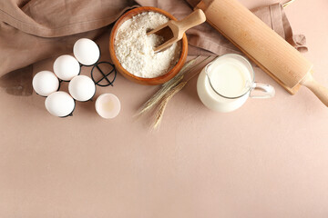 Ingredients for preparing bakery and utensils on color background