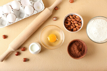 Ingredients for preparing bakery and utensils on color background
