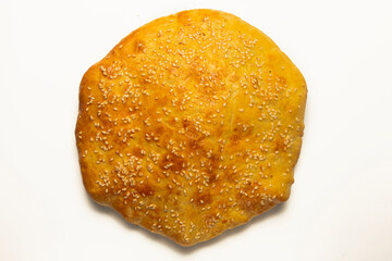 Khachapuri with cheese served on a wooden board isolated on white. Traditional Georgian cuisine concept.
