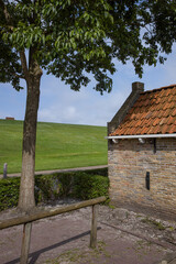 Small fishermen house at Waddenzee coast Moddergat Paesens Friesland Netherlands. Unesco world heritage. 