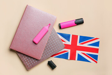 Fototapeta na wymiar Stationery and UK flag on color background. Concept of learning English