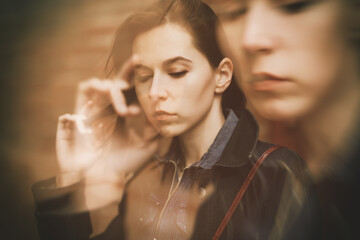 Double exposure of young woman. Abstract portrait.