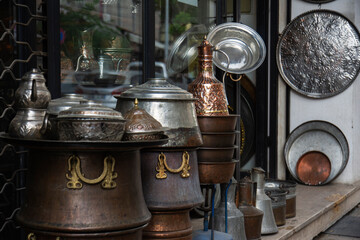 Fototapeta na wymiar handmade authentic copper cauldrons, urns, pitchers, pots, trays and decorative products.