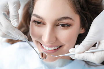 Young woman visiting dentist in clinic, closeup