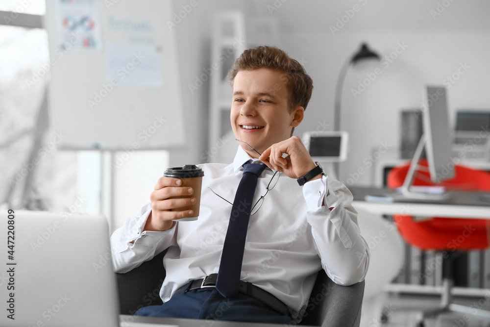 Canvas Prints young man drinking coffee in office