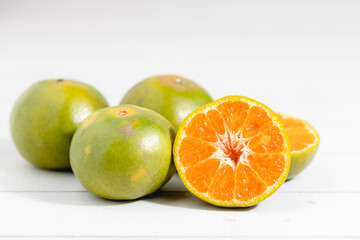 Orange on white wooden background for fruit and eating concept
