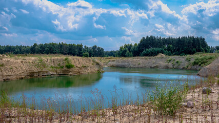 Fototapeta na wymiar Gravel pit. A lake that fills the former pits with water.