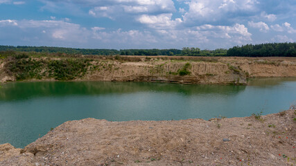 Fototapeta premium Gravel pit. A lake that fills the former pits with water.