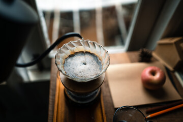 drip coffee in house,Pouring a hot water over a drip coffee