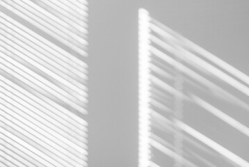 Shadow of window blinds on wall
