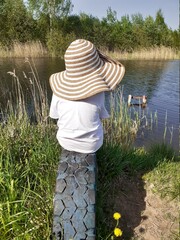 girl, hat and pond