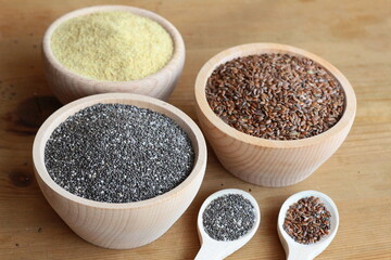 LInseed and chia seeds in wooden bowls

