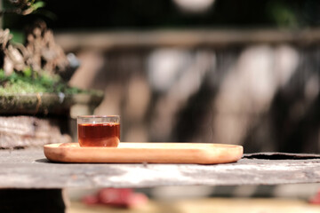 Romantic morning. Wooden tea table, tea cup. Interior green tones. High quality photo