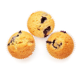 Tasty blueberry muffins on white background