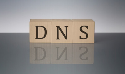 DNS concept, wooden word block on the grey background