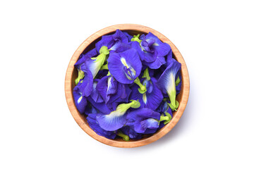 Flat lay of butterfly pea in wooden bowl isolated on white background. clipping path.