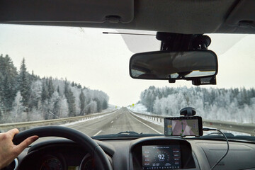 Siberia, Russia - November 28, 2020: View from of car interior from side of driver to the road and...