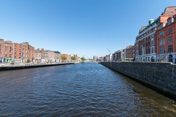 Fototapeta na wymiar River Liffey and colorful buildings at summer day in Dublin, Ireland