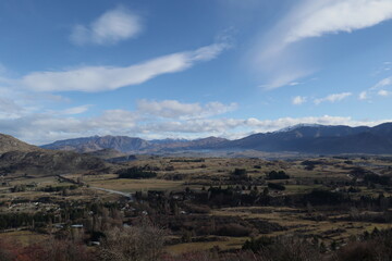 New Zealand Landscape with mountains, sky , water and trees