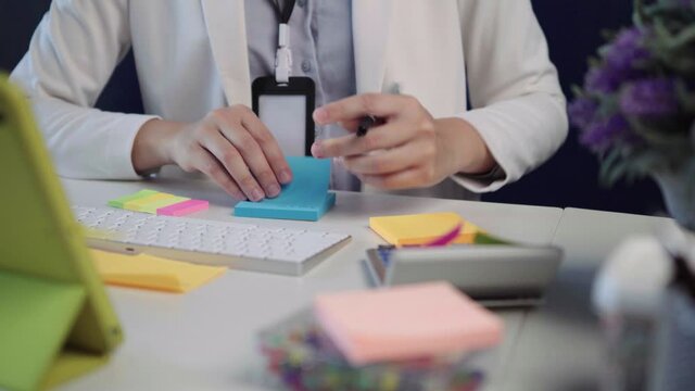 salary employee working at her desk in the office during office hours.
