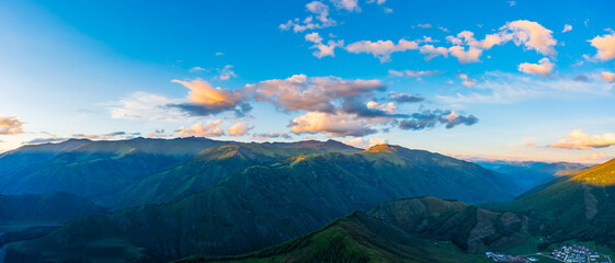 Aerial View of mountain and green forest at sunset in Xinjiang,China.