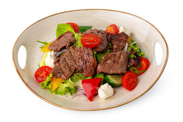 Fillet of beef with vegetable salad on wooden table