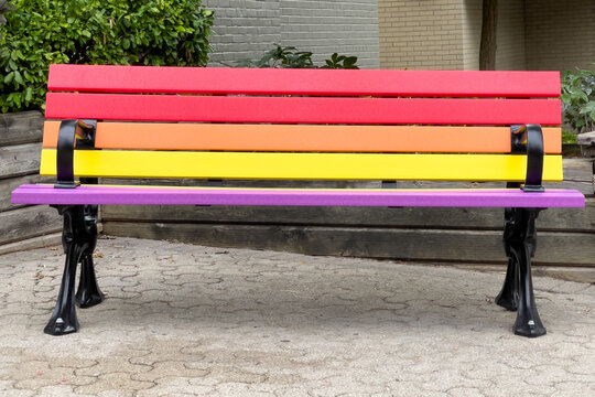 Bench with the Pride rainbow colors in the old town in Newmarket, Ontario, Canada