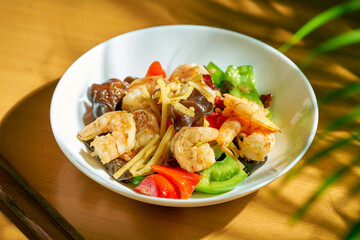 Chinese style spicy shrimp with wok vegetables.