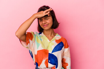 Young mixed race woman isolated on pink background touching temples and having headache.