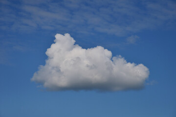 Cumulus clouds on clear sunny day as background