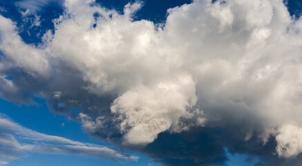 Part of storm cloud on a blue sky