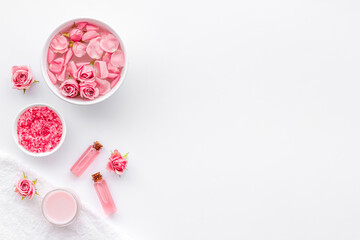 Roses petals in water with sea salt and aroma oil. Spa cosmetics