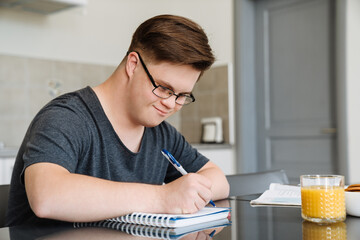 Smiling white young man with down syndrome © Drobot Dean
