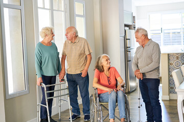 Group of seniors in a relaxed conversation in the retirement home
