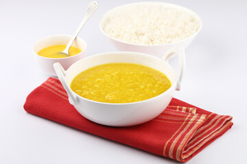 Indian staple food everyday meal Dal Rice or yellow lentil soup with white rice and ghee also...