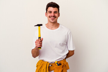 Young caucasian worker man with tools isolated on white background happy, smiling and cheerful.