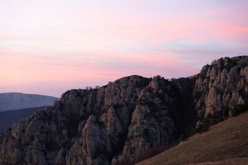 Fototapeta na wymiar Evening mountain landscape, sunset pink-purple sky of Demerdzhi.