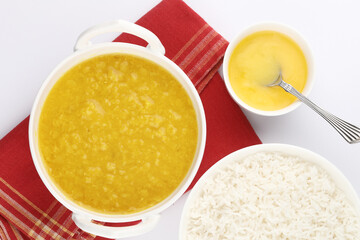 Indian staple food everyday meal Dal Rice or yellow lentil soup with white rice and ghee also called dal chaval & varan bhat