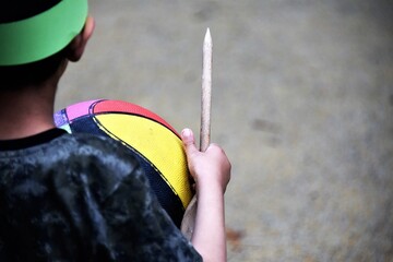 Child at a party playing with a ball