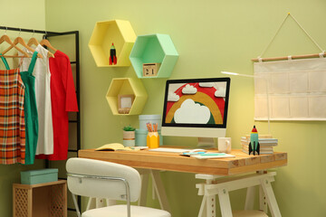 Stylish workplace with computer on wooden desk indoors. Interior design