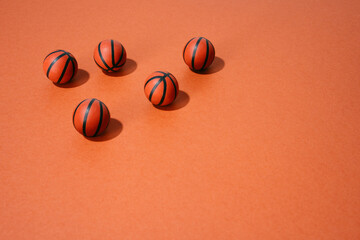 various basketballs on red background. sport and competition.copy space.