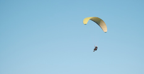 Paragliders against the blue sky. Air sports. Active rest outside the city