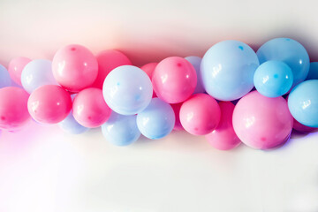 gender reveal party blue and pink balloons in living room on white wall definition of a boy or girl, gathering party party decoration