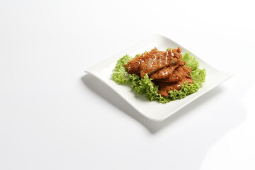 deep fried pork chop with chef special mayonnaise sauce in white black background dim sum snack halal menu