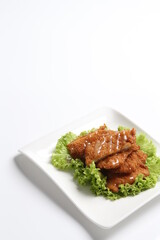 deep fried pork chop with chef special mayonnaise sauce in white black background dim sum snack halal menu