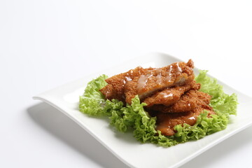 deep fried pork chop with chef special mayonnaise sauce in white black background dim sum snack halal menu