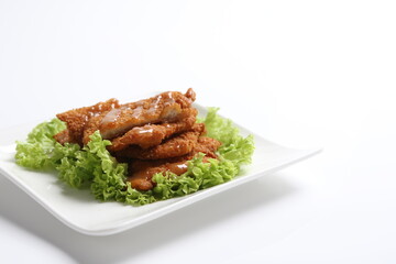 deep fried pork chop with chef special mayonnaise sauce in white black background dim sum snack halal menu