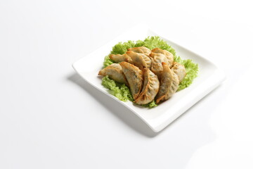 deep fried pork dumpling guo tie jiaozi dim sum in white black background dim sum snack halal menu